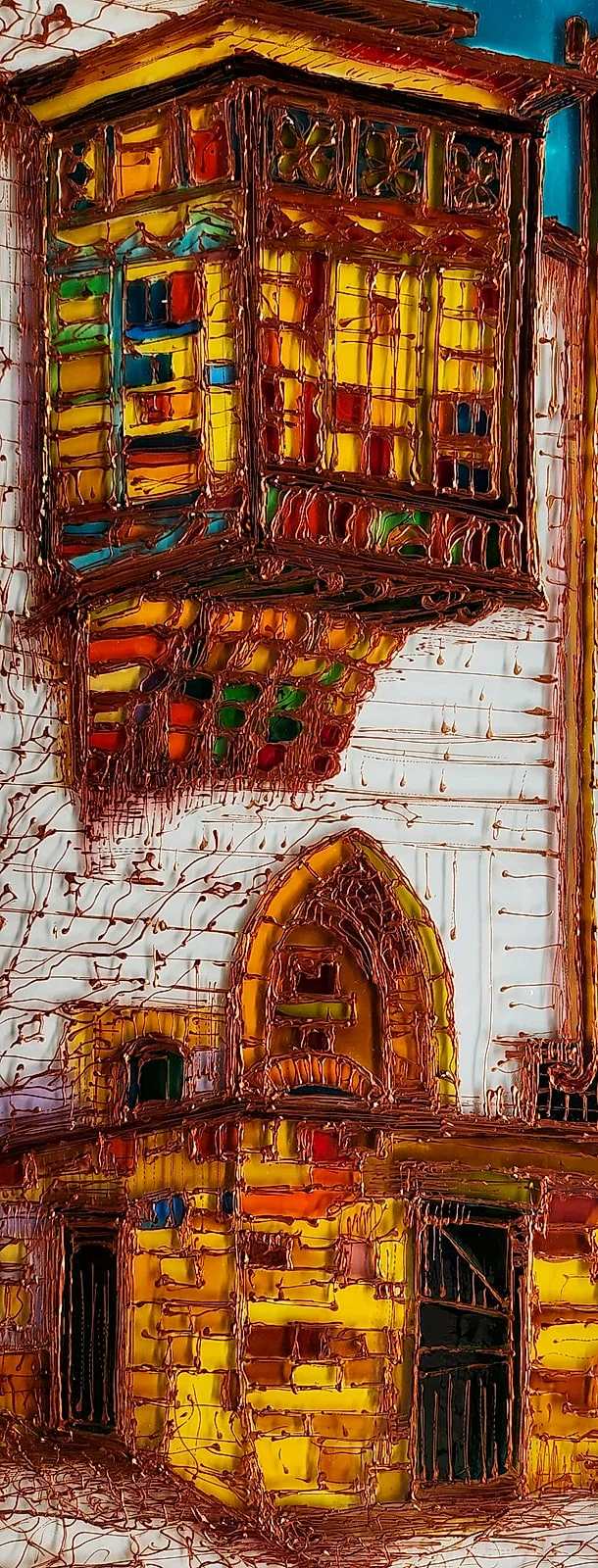A wooden balcony glazed in amber, red, and green projects above a pointed arch window, its edges traced in raised copper-coloured outlines