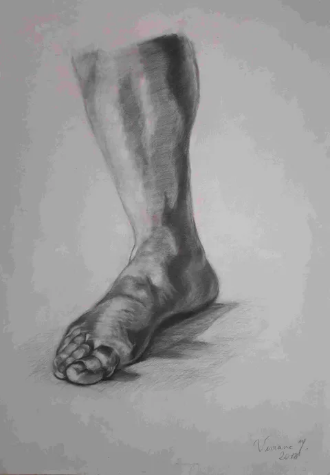 A bare foot and lower leg emerge through careful charcoal modeling of weight, structure, and cast shadow
