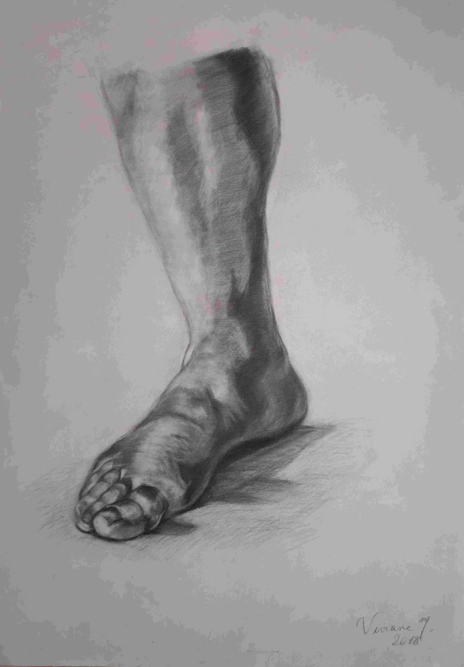 A bare foot and lower leg emerge through careful charcoal modeling of weight, structure, and cast shadow