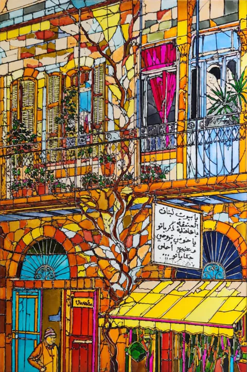 A sunlit Lebanese facade in mosaic colour: shuttered windows and wrought-iron balconies, a vine climbing the wall, a striped yellow shop awning and a hand-lettered Arabic sign